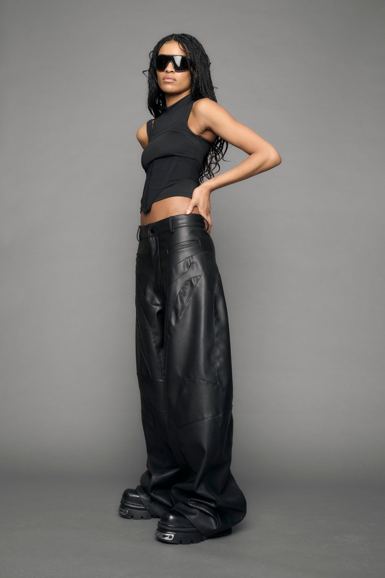 model wearing black vegan moto inspired baggy pants