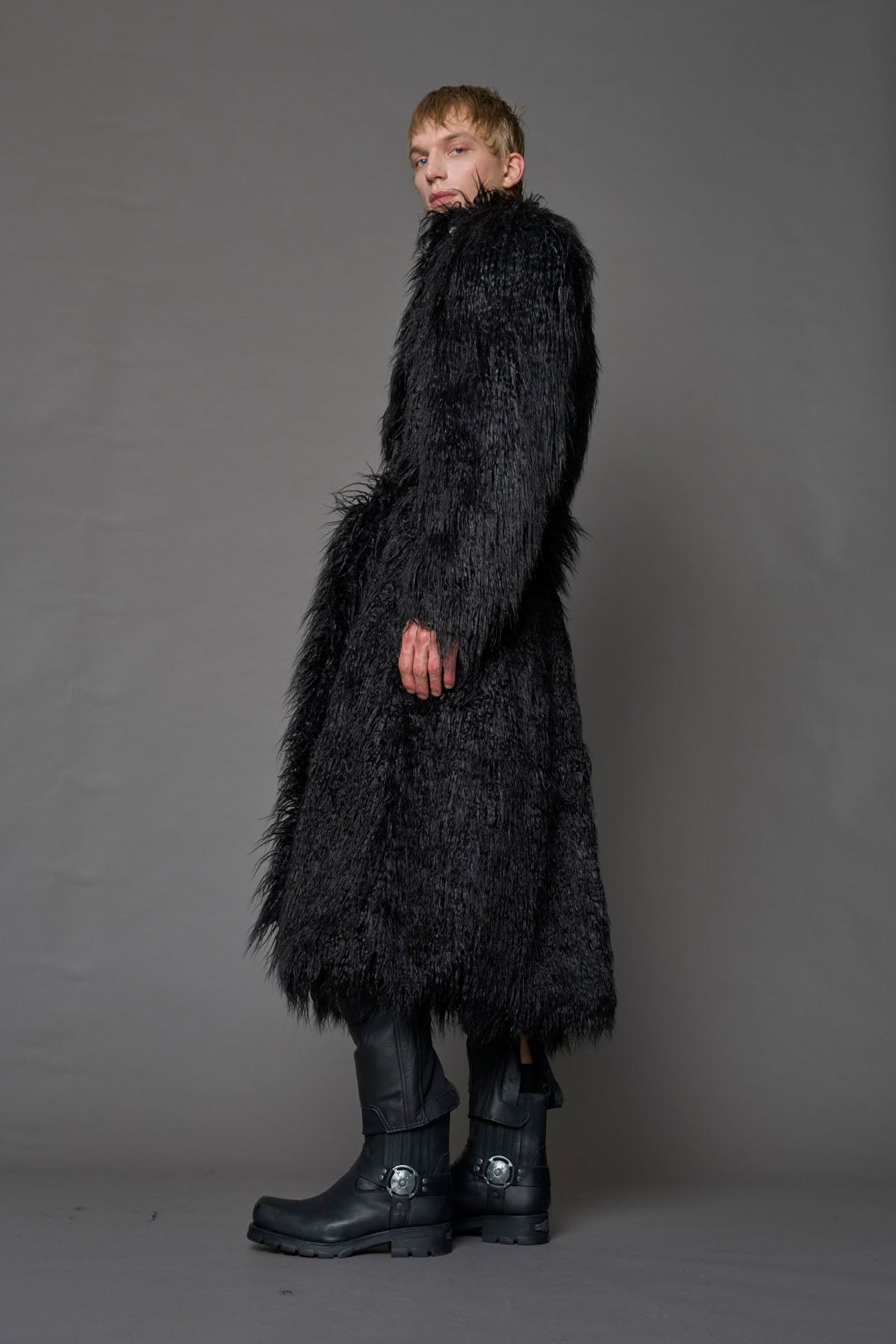 black faux fur coat with shoulder pads and belt