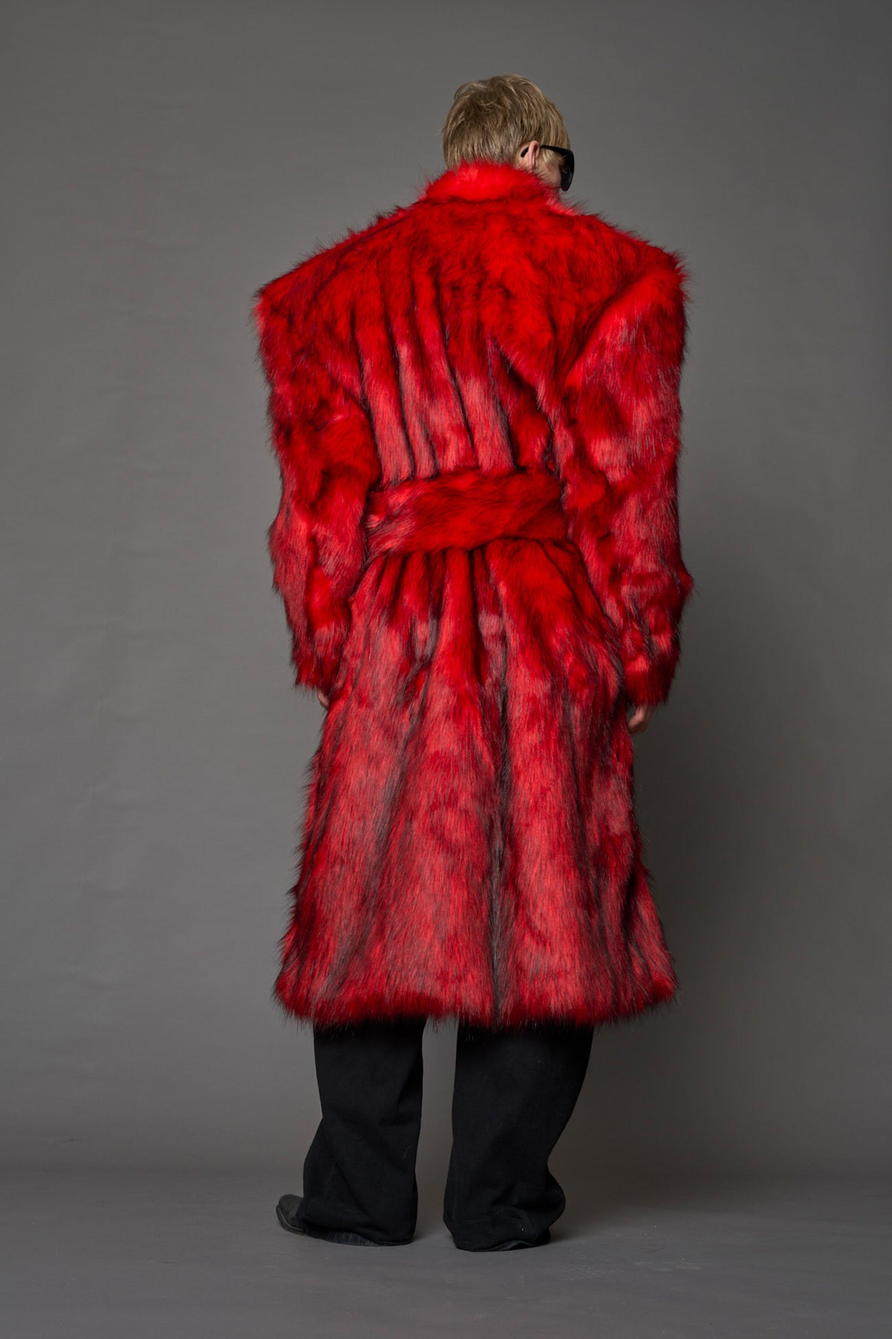 red faux fur coat with shoulder pads and belt