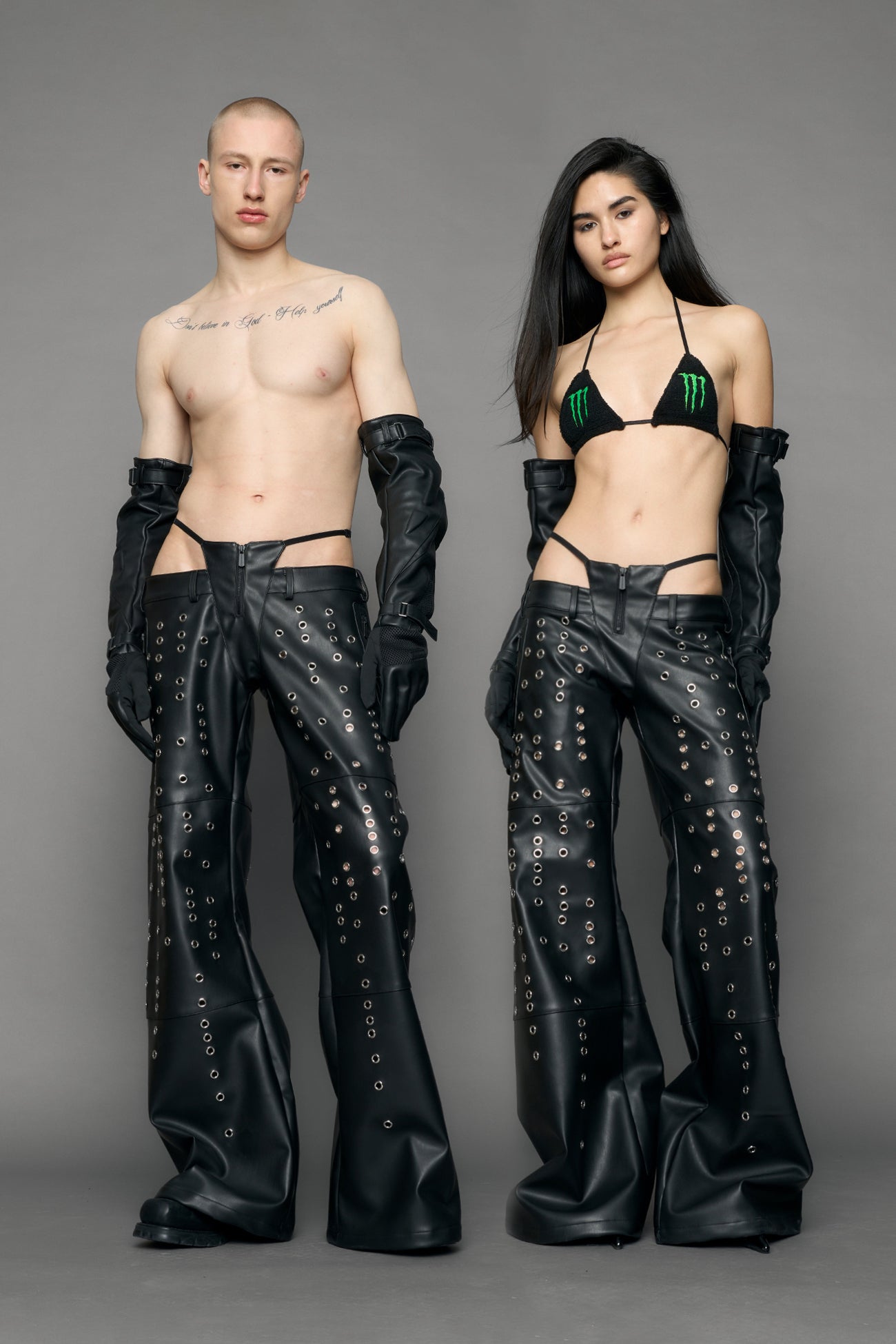 model wearing black pu leather pants with eyelet details