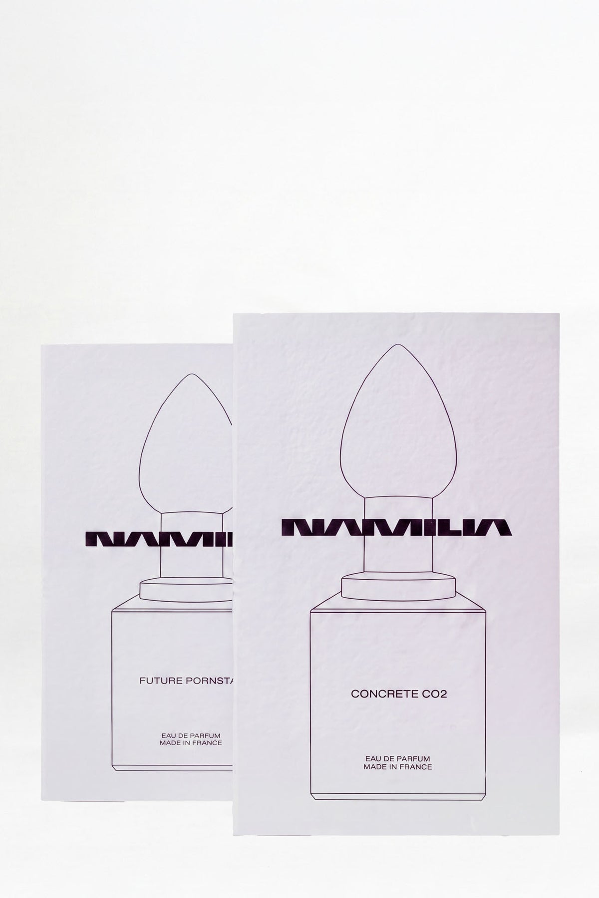 two NAMILIA Parfum tester with black cap and future pornstar and concrete filled inside